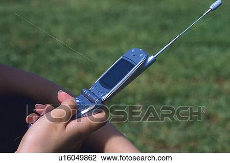 Holding a Mobile Phone, Side View View Large Photo Image Stock Image - Holding a Mobile Phone, Side View. Fotosearch