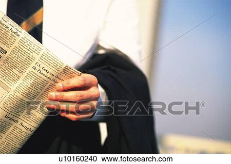 Businessman holding news paper, Front View View Large Photo Image Stock Image - Businessman holding news paper, Front View. Fotosearch