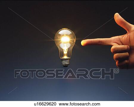 Finger pointing a floating light bulb in the air, Side View View Large Photo Image Stock Image - Finger pointing a floating light bulb in the air, Side View. Fotosearch