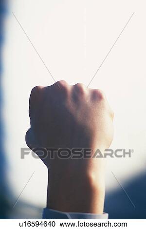 Fist up in the air, Low Angle View View Large Photo Image Stock Image - Fist up in the air, Low Angle View. Fotosearch