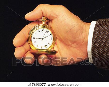Hand holding a fob watch, Close Up View Large Photo Image Stock Photo - Hand holding a fob watch, Close Up. Fotosearch