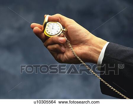 Hand holding a fob watch, Side View View Large Photo Image Picture - Hand holding a fob watch, Side View. Fotosearch