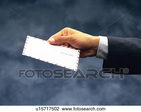 Hand holding a mail, Side View View Large Photo Image Stock Image - Hand holding a mail, Side View. Fotosearch