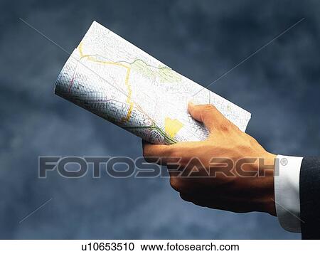 Hand holding a map, Close Up View Large Photo Image Stock Image - Hand holding a map, Close Up. Fotosearch