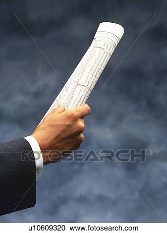 Hand holding folded news paper, Side View View Large Photo Image Stock Image - Hand holding folded news paper, Side View. Fotosearch