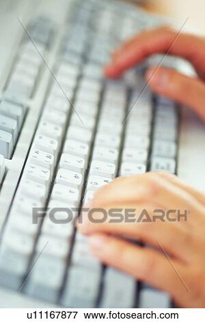 Hand typing keyboard, High Angle View View Large Photo Image Stock Photo - Hand typing keyboard, High Angle View. Fotosearch