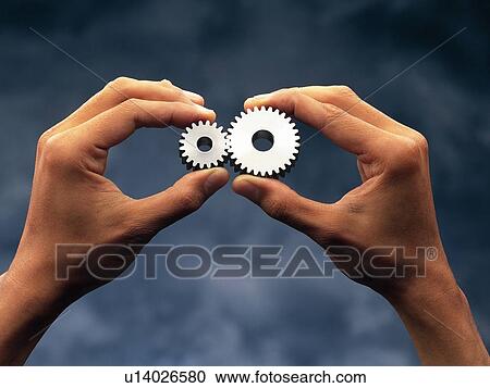 Hands holding gearwheels, Close Up View Large Photo Image Stock Image - Hands holding gearwheels, Close Up. Fotosearch