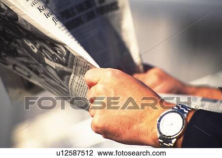 Hands holding news paper, Side View View Large Photo Image Stock Image - Hands holding news paper, Side View. Fotosearch