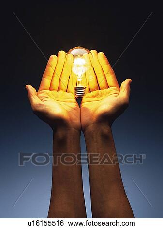 Light bulb floating above hands, Side View View Large Photo Image Stock Photograph - Light bulb floating above hands, Side View. Fotosearch