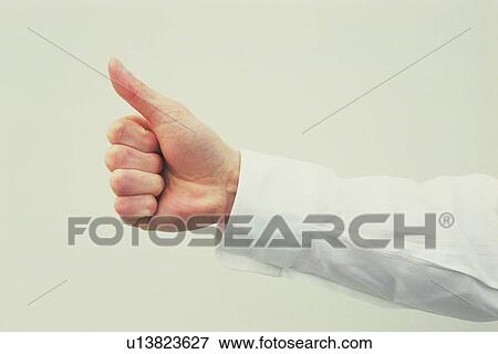 Stock Photo - Thumb up in the air, Side View. Fotosearch