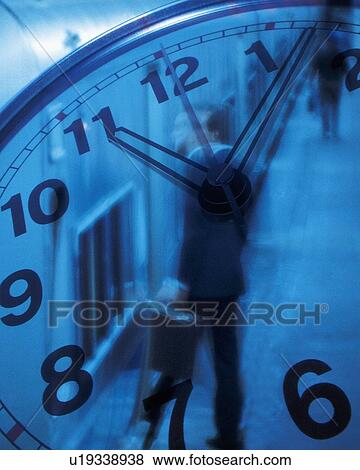 Businessman getting on train, with image of clock, CG, composition, blurred motion, toned image View Large Photo Image Stock Photo - Businessman getting on train, with image of clock, CG, composition, blurred motion, toned image. Fotosearch