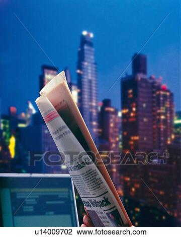 Businessman holding folded newspaper in office, CG, composition View Large Photo Image Stock Image - Businessman holding folded newspaper in office, CG, composition. Fotosearch