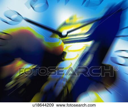 Stock Photo - Businessman pushing buttons of mobile phone with image of clock, CG, composition, blurred motion, close up. Fotosearch