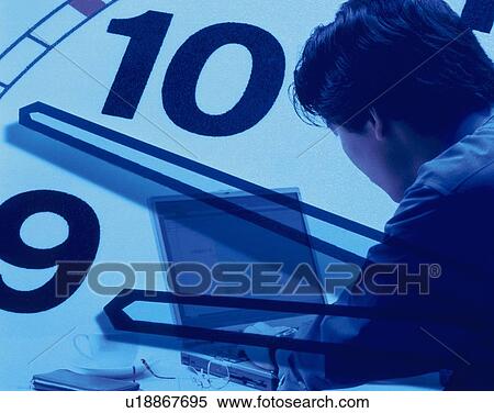 Stock Photography - Businessman using laptop and image of clock, CG, composition, rear view, toned image. Fotosearch