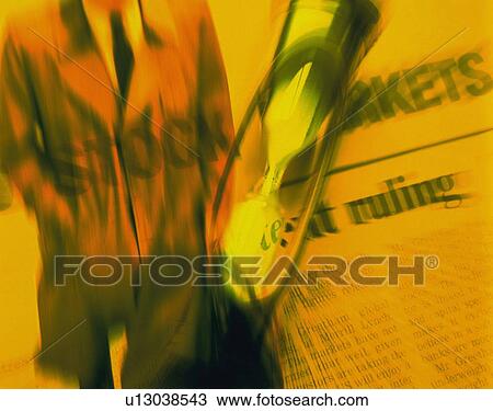 Businessman with image of hourglass and newspaper, CG, composition, blurred motion View Large Photo Image Stock Image - Businessman with image of hourglass and newspaper, CG, composition, blurred motion. Fotosearch