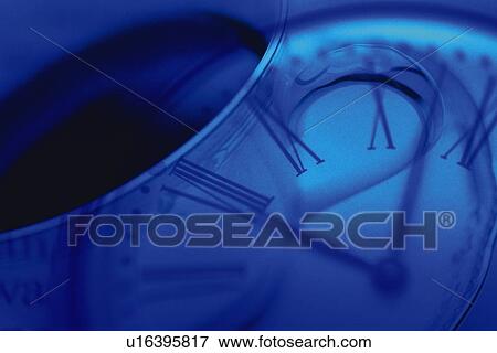 Stock Photo - Clock and a cup of coffee, CG, composition, toned image. Fotosearch