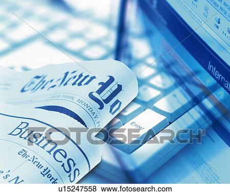 Stock Photo - Newspaper and personal computer, CG, composition, high angle view, close up, toned image. Fotosearch
