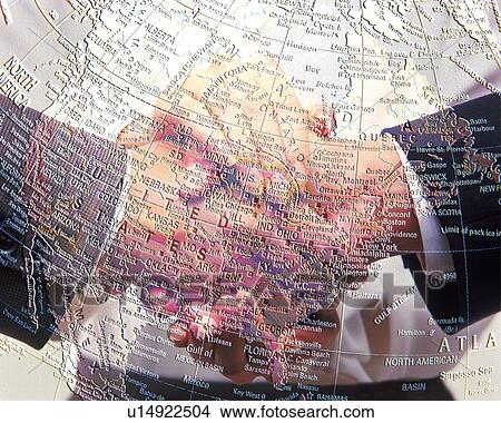 Three men holding and shaking hands with image of globe, CG, composition, close up View Large Photo Image Picture - Three men holding and shaking hands with image of globe, CG, composition, close up. Fotosearch