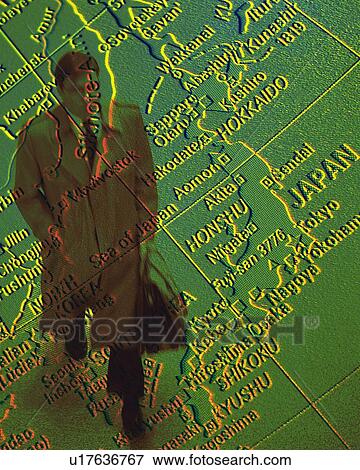 Businessman and globe, CG, composition, high angle view View Large Photo Image Stock Photo - Businessman and globe, CG, composition, high angle view. Fotosearch