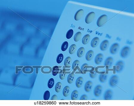 Stock Image - Calendar and computer keyboard, close up, soft focus, toned image. Fotosearch
