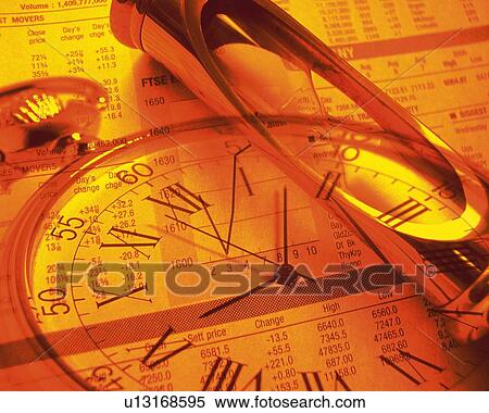 Stock Photography - Clock and hourglass with image of newspaper, CG, composition, toned image, high angle view. Fotosearch