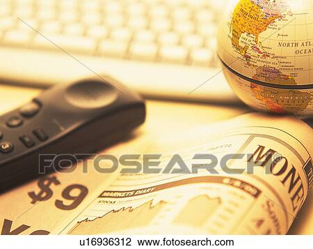 Globe, phone receiver, financial press and computer keyboard on desk, high angle view, close up, soft focus View Large Photo Image Stock Image - Globe, phone receiver, financial press and computer keyboard on desk, high angle view, close up, soft focus. Fotosearch