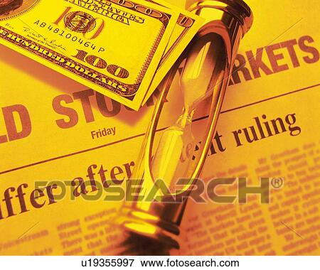 Hourglass and US banknotes on newspaper, toned image, high angle view, close up View Large Photo Image Stock Photo - Hourglass and US banknotes on newspaper, toned image, high angle view, close up. Fotosearch