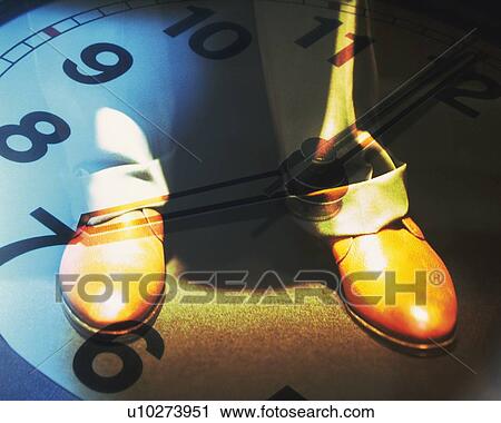 Stock Image - Standing businessman and image of clock, CG, composition. Fotosearch
