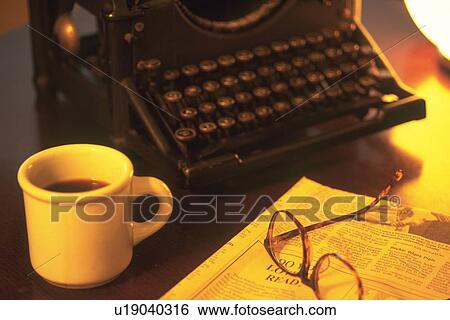 Typewriter and a cup of coffee on desk, high angle view View Large Photo Image Stock Photograph - Typewriter and a cup of coffee on desk, high angle view. Fotosearch
