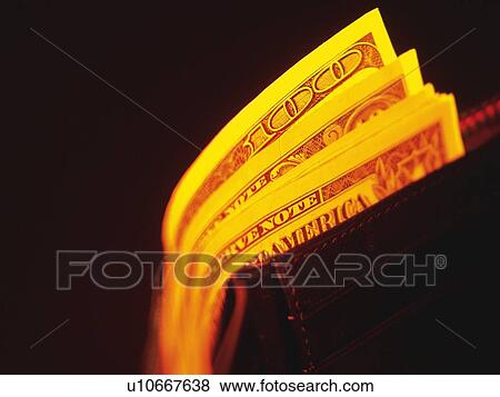 US banknotes in purse, high angle view, close up, black background View Large Photo Image Stock Photo - US banknotes in purse, high angle view, close up, black background. Fotosearch