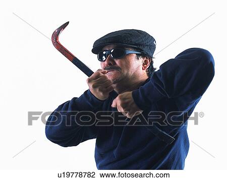 Stock Image - Burglar breaking in, Front View. Fotosearch
