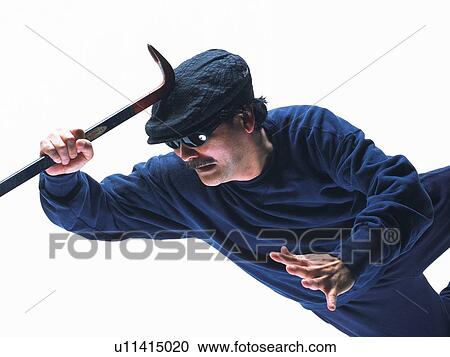 Stock Image - Burglar breaking in, Side View. Fotosearch