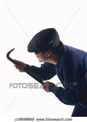 Stock Photo - Burglar breaking in, Side View. Fotosearch