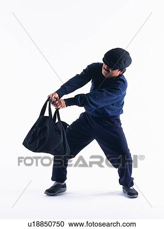 Burglar trying to escape with a bag, Front View View Large Photo Image Stock Image - Burglar trying to escape with a bag, Front View. Fotosearch