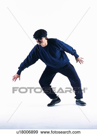 Stock Photo - Burglar walking with stealthy footsteps, Side View. Fotosearch