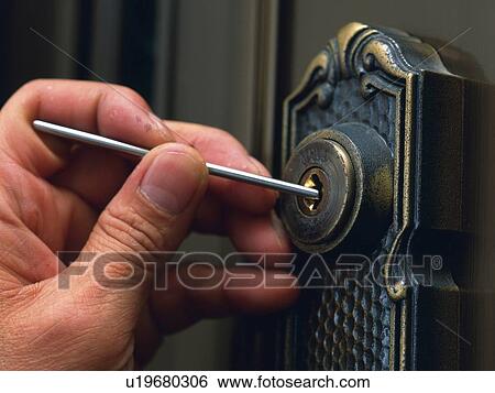 Stock Photograph - Hand breaking in, Close Up. Fotosearch