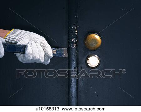 Hand breaking in with an iron bar, Front View View Large Photo Image Stock Image - Hand breaking in with an iron bar, Front View. Fotosearch