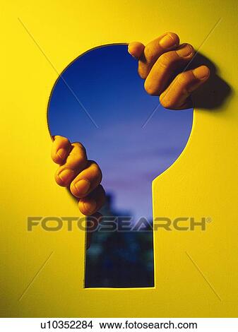 hands grabbing the edge of the Key hole, Composite View Large Photo Image Picture - hands grabbing the edge of the Key hole, Composite. Fotosearch