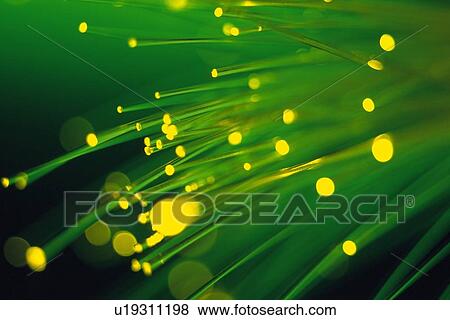 Stock Photo - Bunch of illuminated fiber optics, close up. Fotosearch