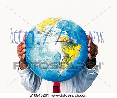 Stock Image - Businessman holding a globe with image of web address, CG, composition, front view. Fotosearch
