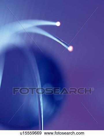 Stock Photo - Illuminated ball of fiber optics, close up, blurred motion, long exposure. Fotosearch
