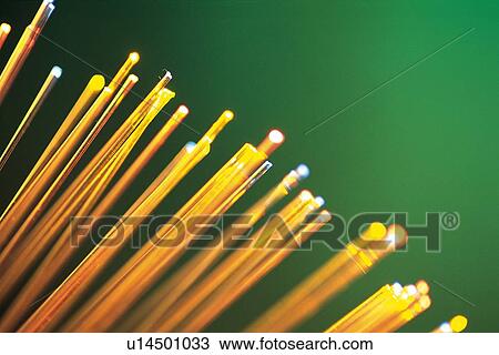 Stock Image - Illuminated fiber optics, close up. Fotosearch