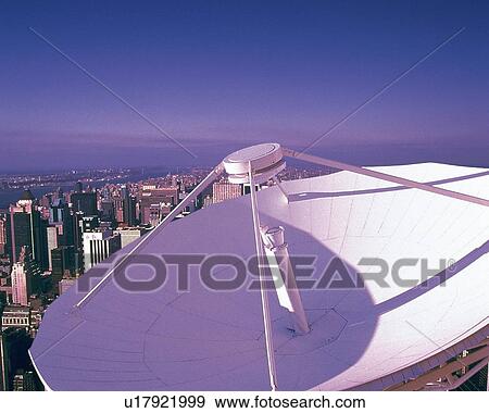 Stock Photo - Satellite dish and high-rise buildings, CG, composition, high angle view. Fotosearch