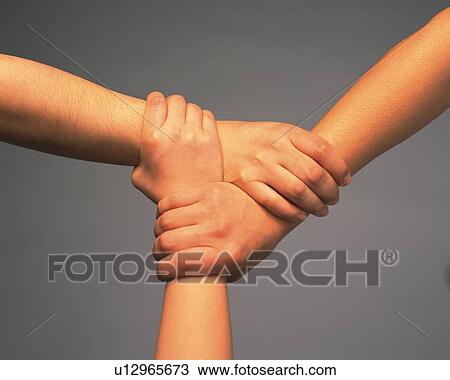 Three people connecting hands, high angle view View Large Photo Image Stock Image - Three people connecting hands, high angle view. Fotosearch