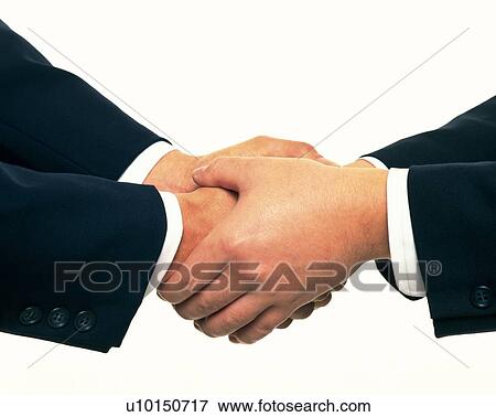Stock Photo - Two men holding and shaking hands, side view, close up. Fotosearch