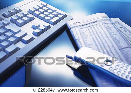 Stock Photo - Keyboard, Mobile Phone and Newspaper, Close Up. Fotosearch