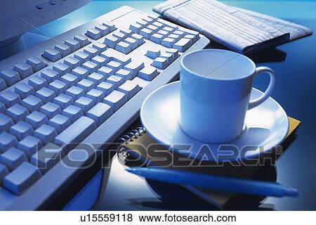 Stock Photo - Keyboard, Newspaper, Memo, Pen and Coffee Cup, Close Up. Fotosearch