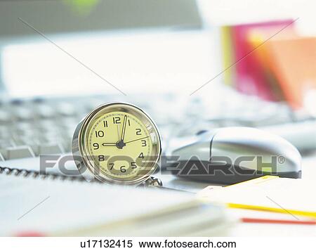 Stock Photography - Clock and office items, Pin Focus, High Angle View. Fotosearch