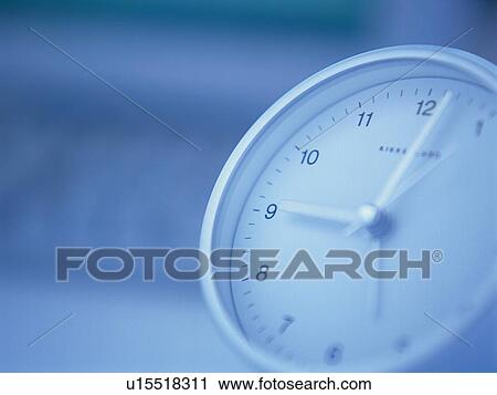 Stock Image - Clock, Pin Focus, High Angle View. Fotosearch