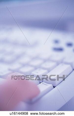 Stock Photo - Finger and keyboard, Pin Focus. Fotosearch